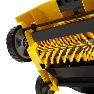 Close-up of a yellow and black brush attachment on a cleaning device.