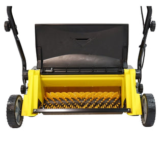 A yellow and black artificial graass sweeper shown from the front, with the deck open to reveal the cutting blades and brush area, isolated on a white background.