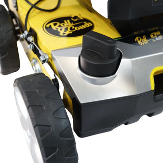 Close-up of a yellow and black lawn mower with 'Roll&Comb' branding.